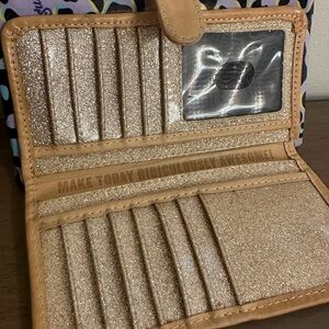 Consuela Slim Wallet.  Only used for 1 week.  Beautiful pink glitter inside.
